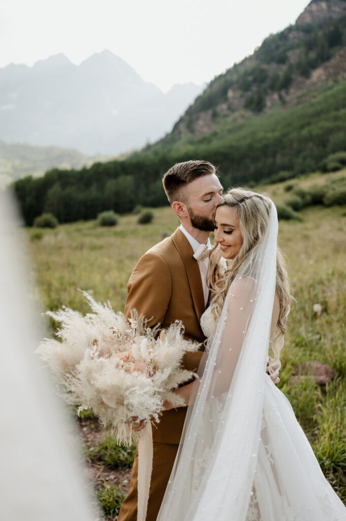 Bride and groom at their Maroon Bells Amphitheater Wedding