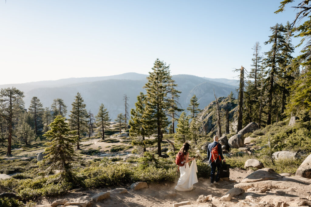 bride and groom hiking to Taft Point in Yosemite National Park