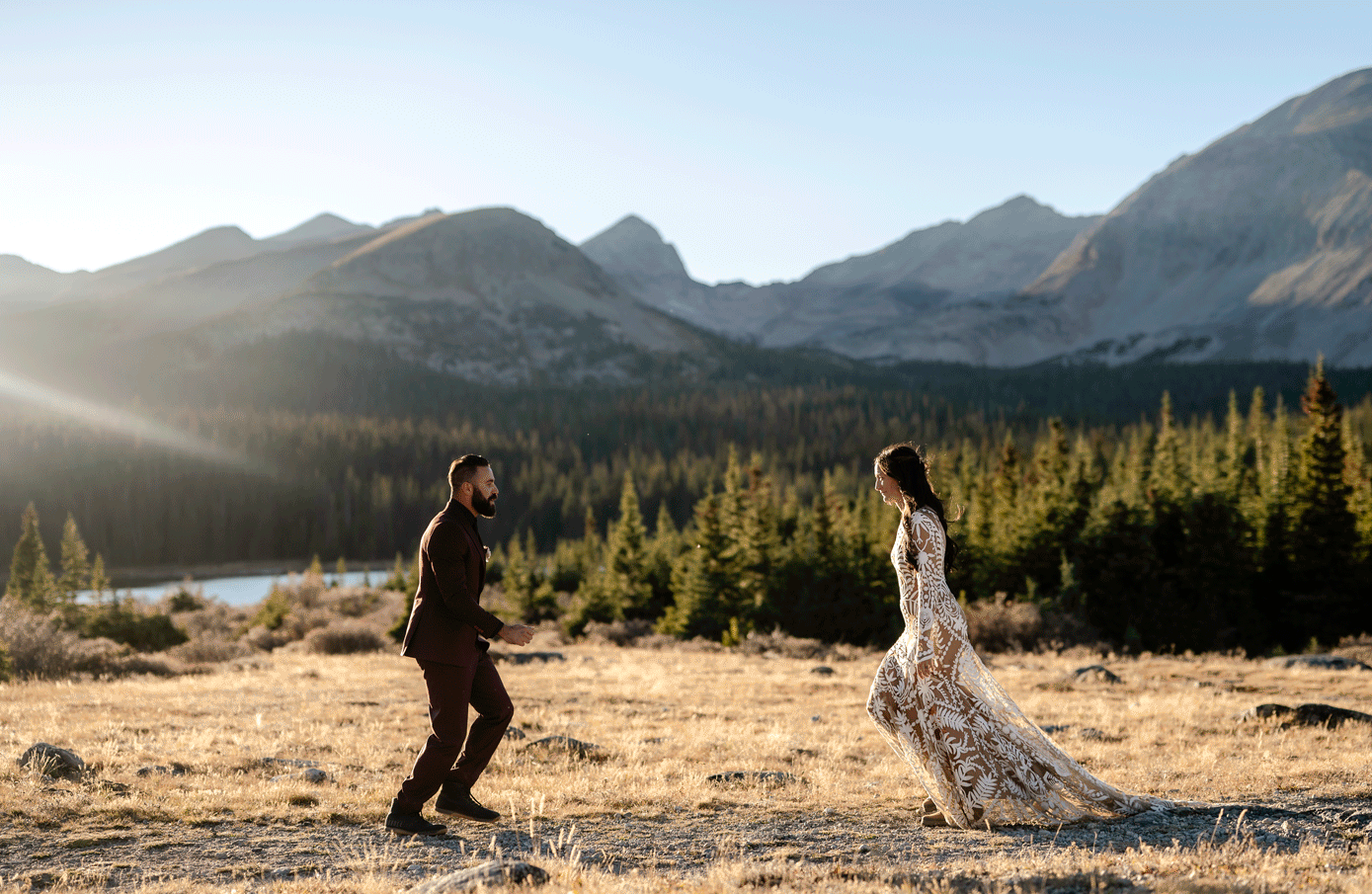A bride and groom running towards each other and spinning